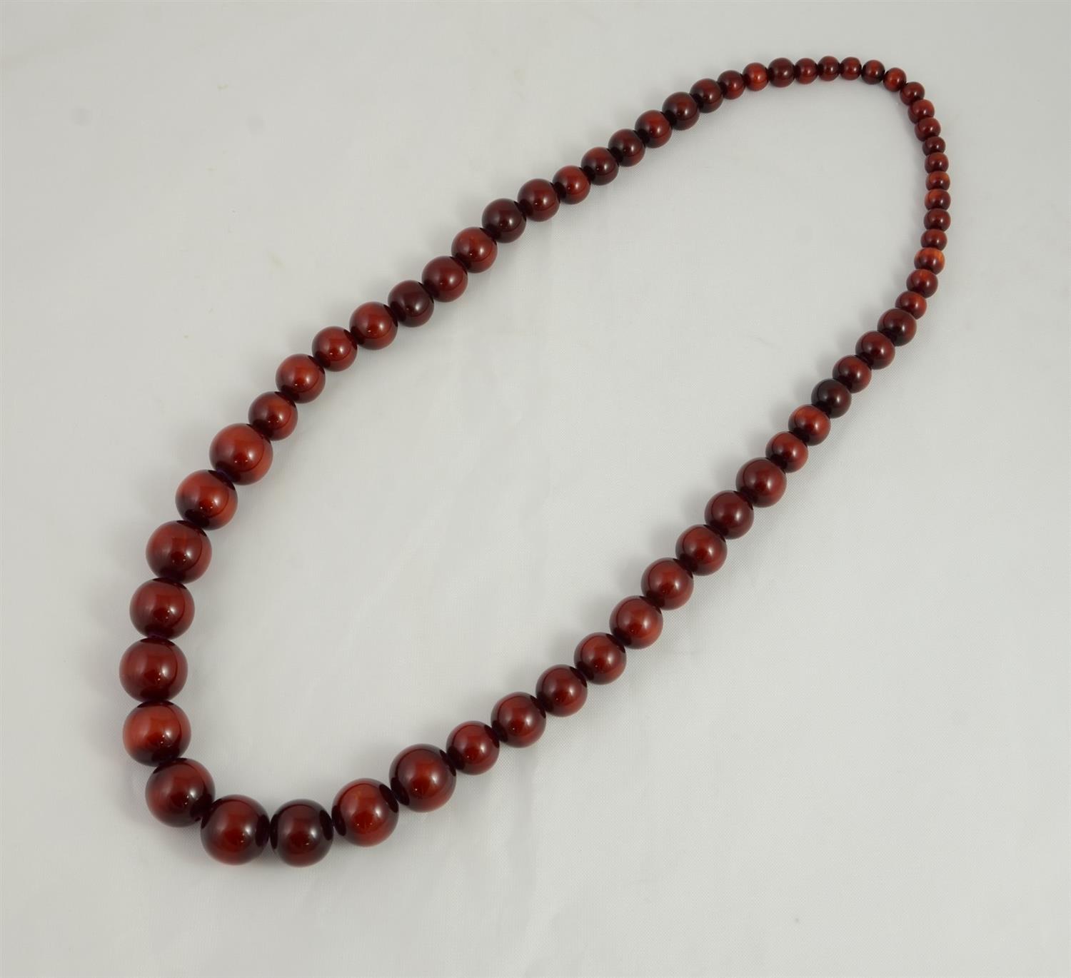 Appraisal: Cranberry resin graduated beaded necklace long