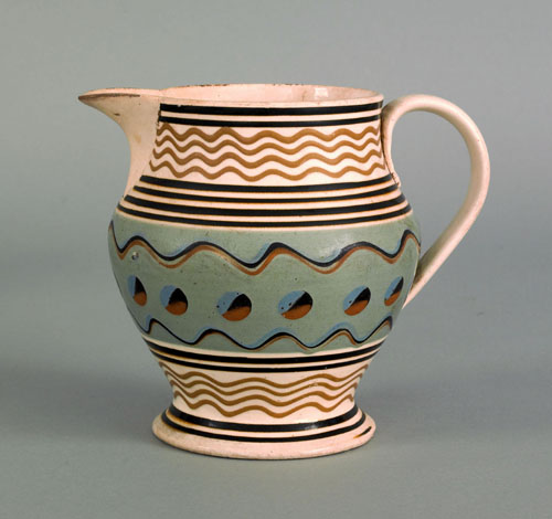 Appraisal: Mocha pitcher th c with cat's-eye and wavy line decoration