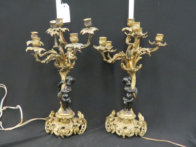 Appraisal: Pair of Bronze Candelabra Lamps figural putti decor rococo design