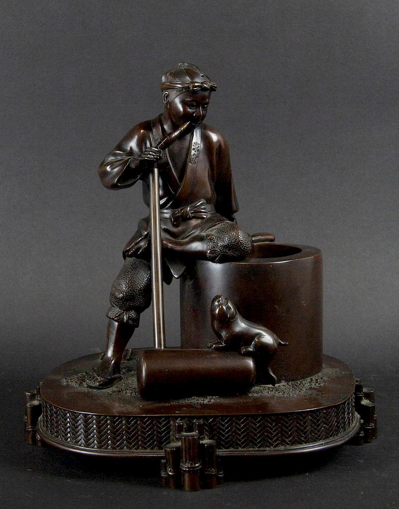 Appraisal: A Meiji Bronze 'Mochitsuki' Figure Japanese Depicting a man and