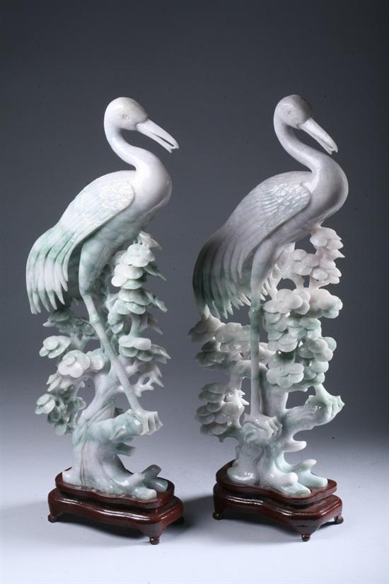 Appraisal: PAIR CHINESE LAVENDER AND APPLE GREEN JADE FIGURES OF BIRDS