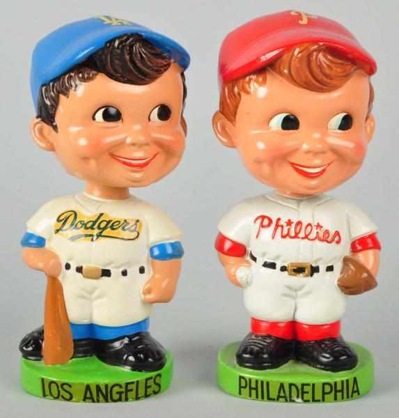 Appraisal: Lot of Baseball Bobbing Head Dolls Description Both are gold