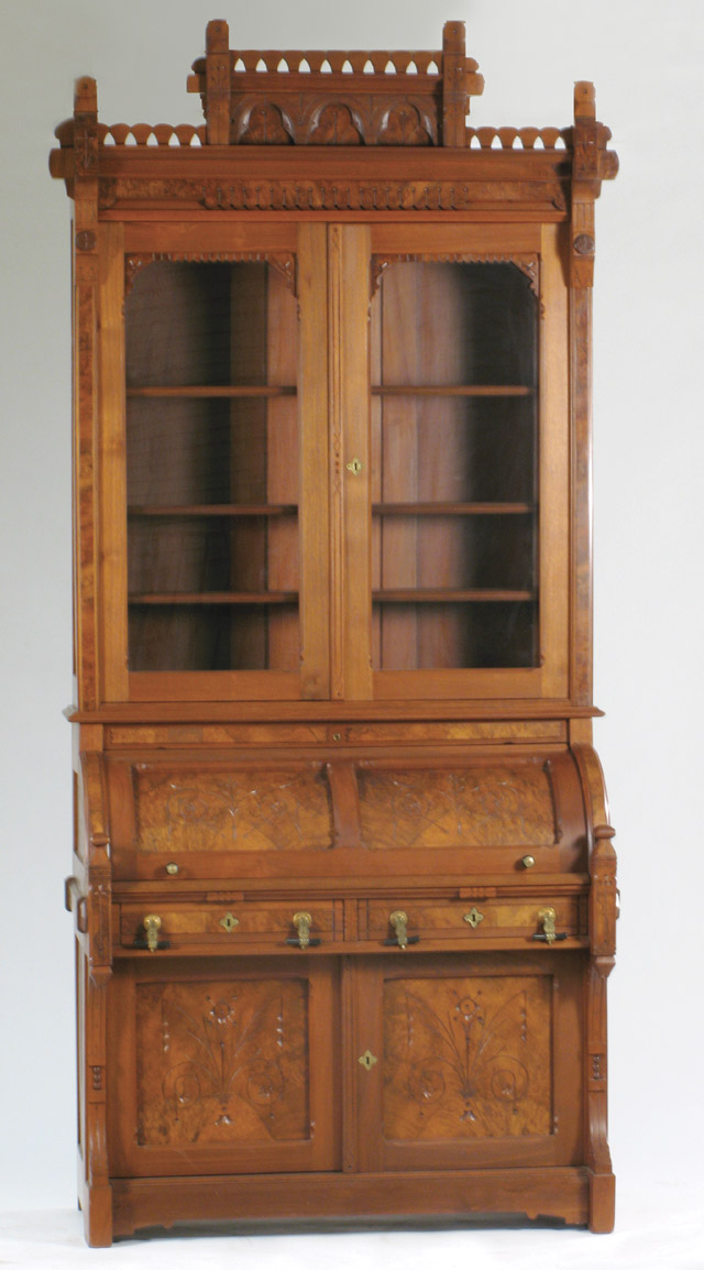 Appraisal: A VICTORIAN WALNUT CYLINDER-ROLL SECRETARY BOOKCASE Eastlake influence American c