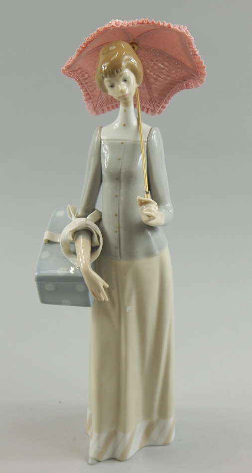 Appraisal: A Lladro porcelain figure of a lady carrying a parasol