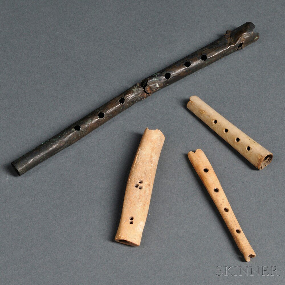 Appraisal: Four Pre-Columbian Flutes includes a copper Chancay end-blown flute and