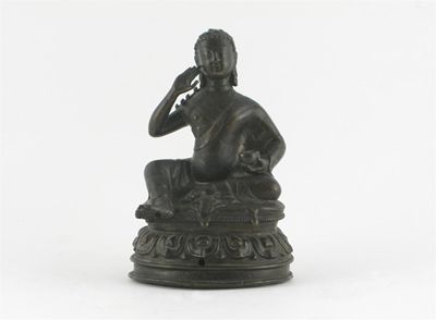 Appraisal: A rare Tibetan bronze figure of Milarepa raised on a