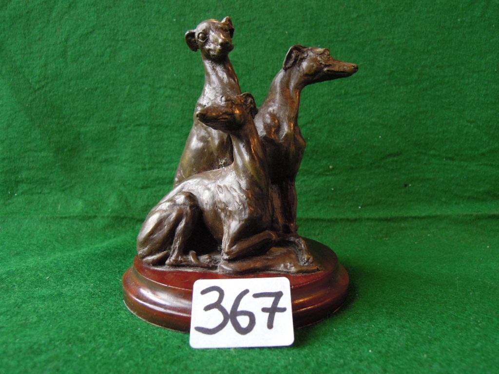 Appraisal: A bronze effect small statue of three seated Grey Hounds