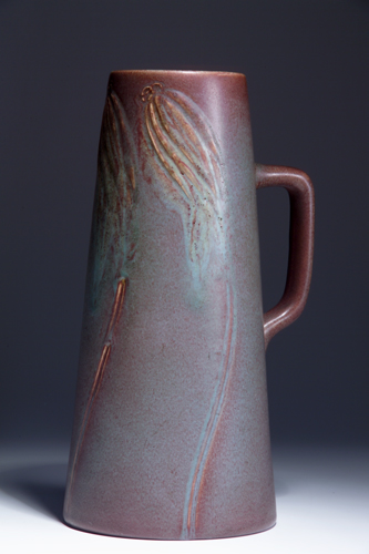 Appraisal: ROOKWOOD Tall Carved Matte tankard by William Hentschel with swaying