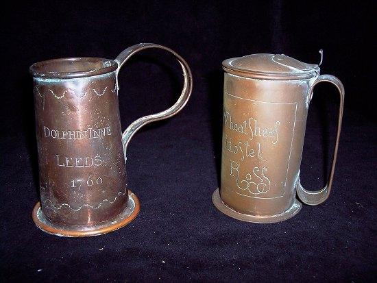 Appraisal: A copper tankard of tapering form engraved a dolphin to