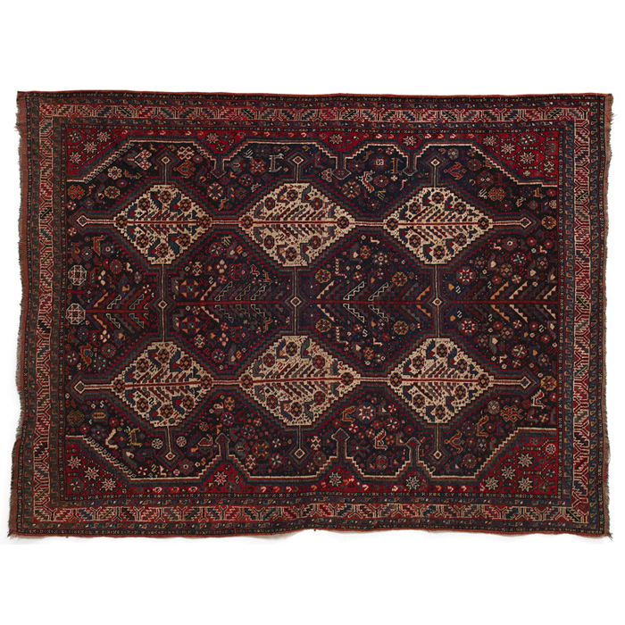 Appraisal: South Persian rug c stylized floral pattern on a red