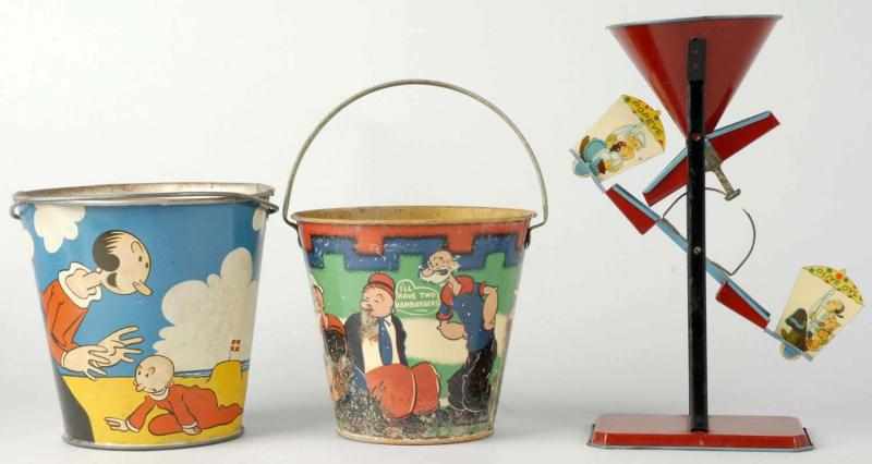 Appraisal: Lot of Tin Litho Popeye Sand Toys Description Includes one