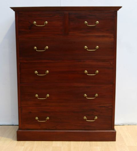 Appraisal: A contemporary mahogany chest of drawers with brass handles two