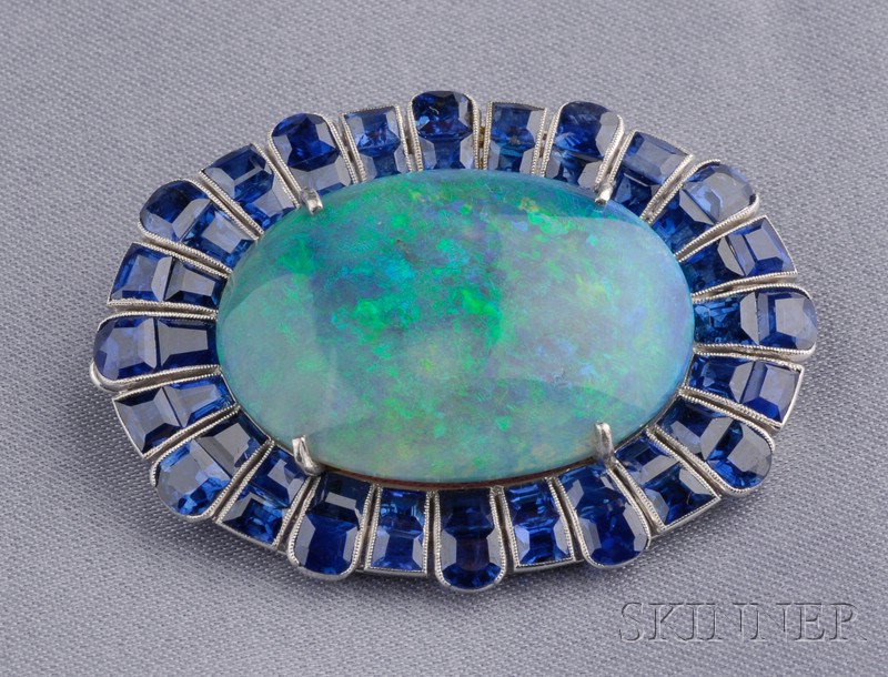 Appraisal: Platinum Opal and Sapphire Brooch prong-set with a black opal