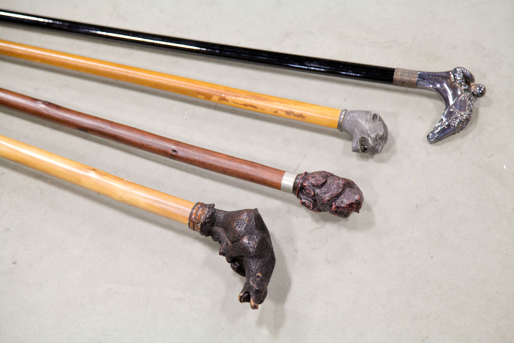 Appraisal: GROUP OF ANIMAL CANES American and foreign th century Wood