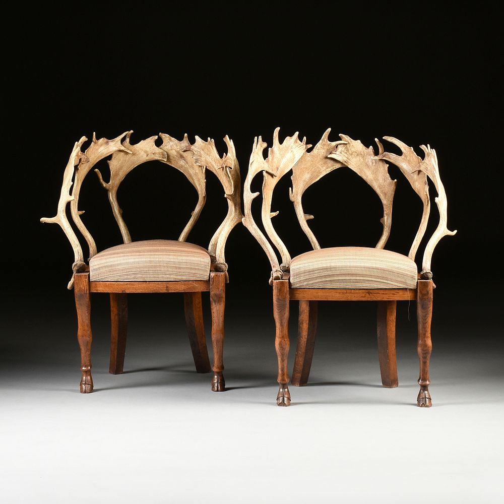 Appraisal: A PAIR OF BIEDERMEIER ANTLER AND CARVED ELM CHAIRS POSSIBLY