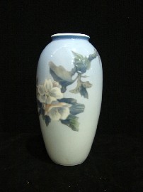 Appraisal: A Royal Copenhagen ovoid form vase with painted white camellias