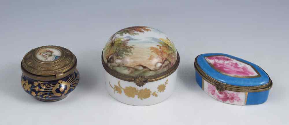 Appraisal: THREE FRENCH PORCELAIN PILL BOXES All hand painted and having