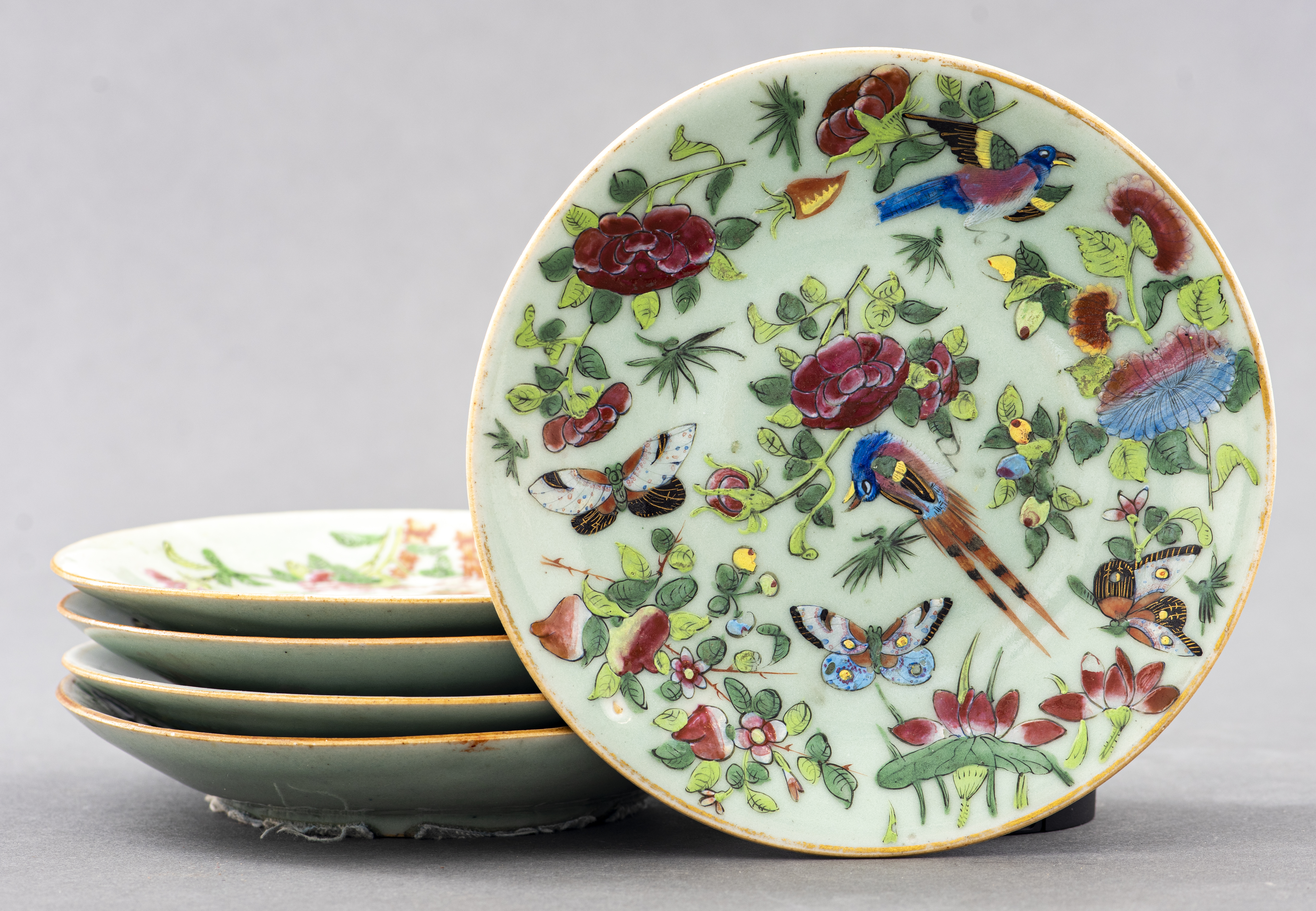 Appraisal: CHINESE CELADON BIRD AND FLOWER PLATES Five Chinese celadon Bird