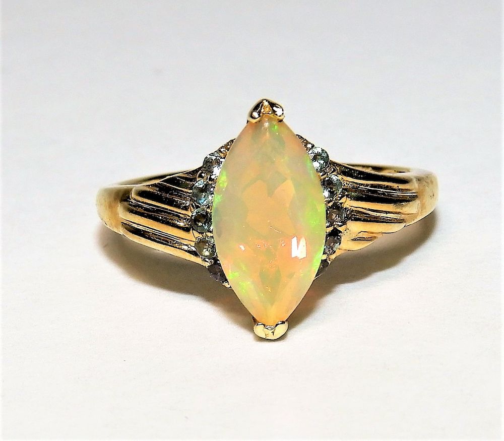 Appraisal: K Yellow Gold Opal Light Blue Sapphire Ring Contemporary Marquis