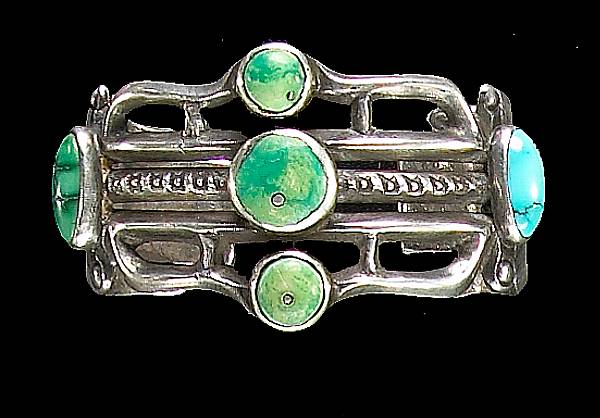 Appraisal: A Navajo bracelet Openwork bands set with five turquoise stones