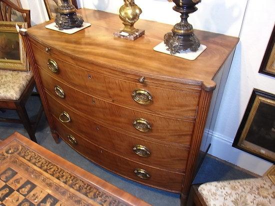 Appraisal: A REGENCY MAHOGANY BOW FRONT CHEST of four long graduated