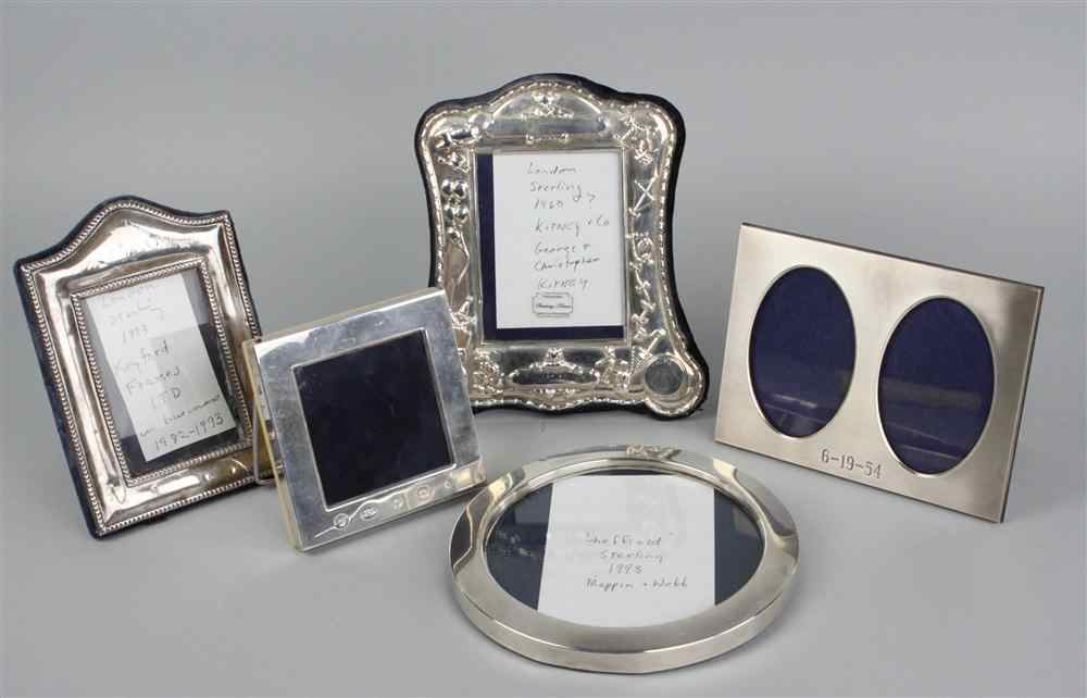 Appraisal: FIVE STERLING MOUNTED PICTURE FRAMES including round Mappin Webb frame