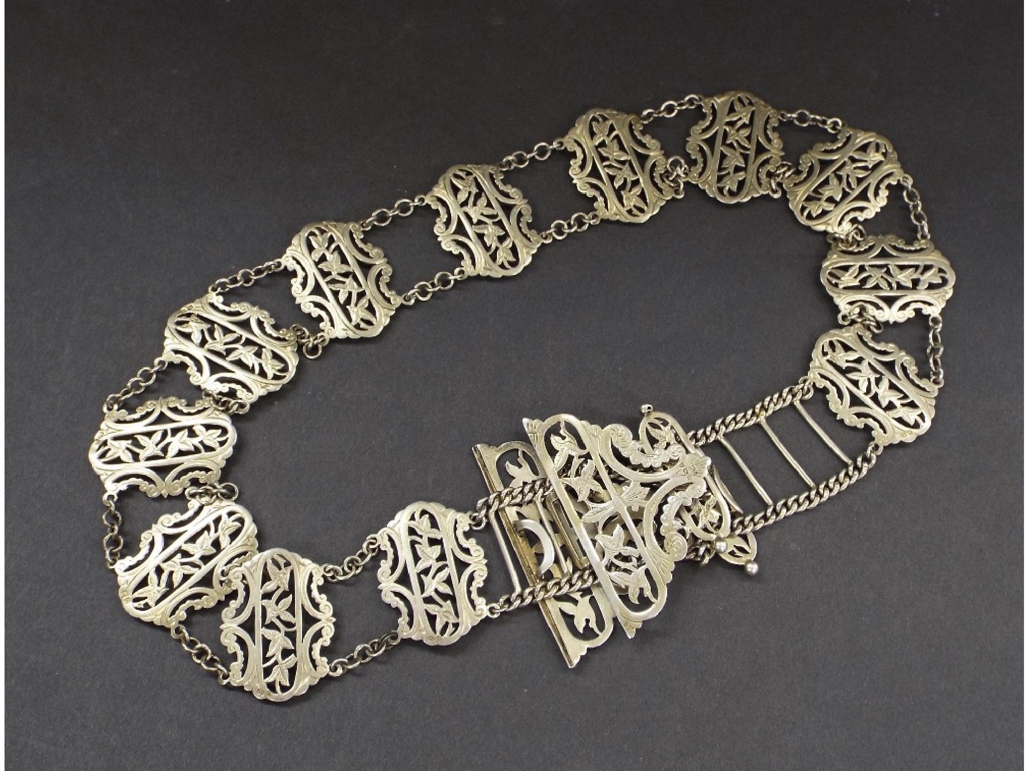 Appraisal: Edwardian silver chain link nurse's belt fitted with geometric floral