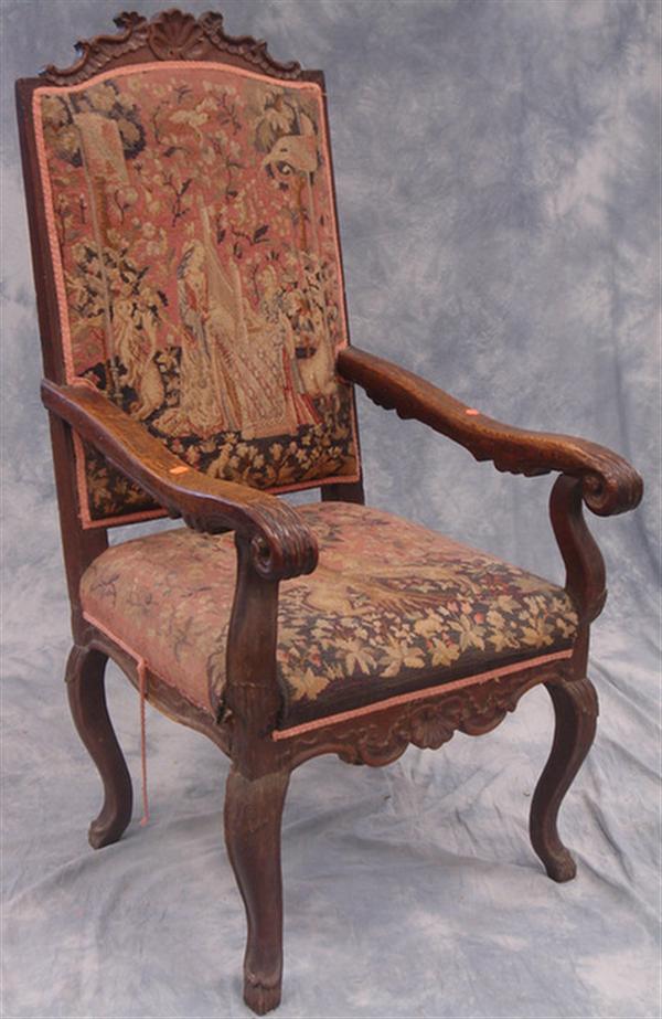 Appraisal: Carved oak French high back armchair needlework back and seat