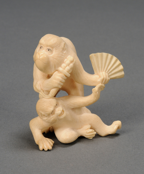 Appraisal: Ivory Carving Japan th century two monkeys with a sambaso