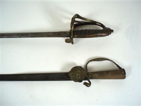 Appraisal: An Infantry officers sword pattern with brass hilt with 'VR'