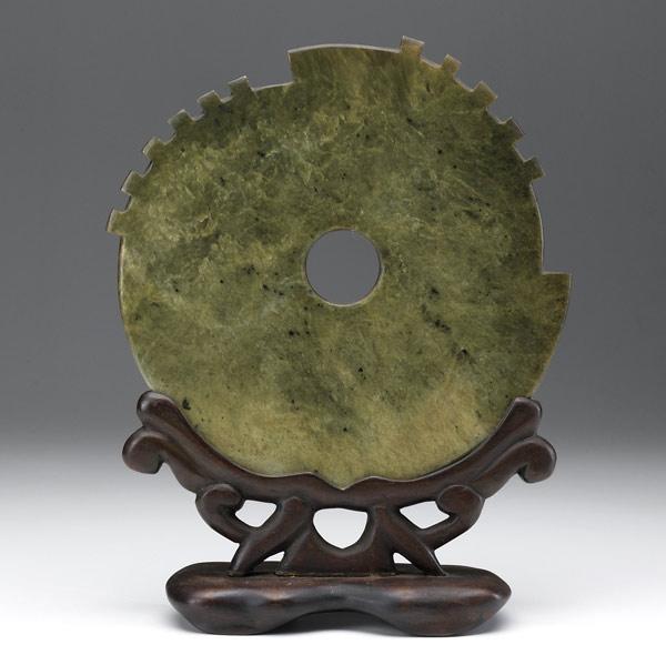 Appraisal: Green jade disc on wood stand th C Round form