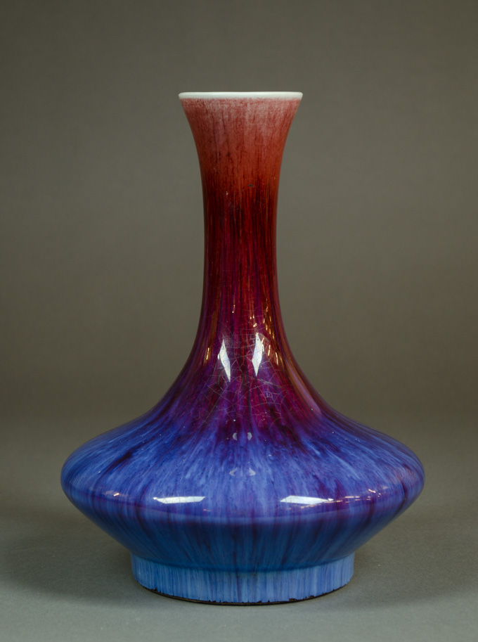 Appraisal: CHINESE FLAMBE GLAZED PORCELAIN VASE low-shoulder form with variegated red