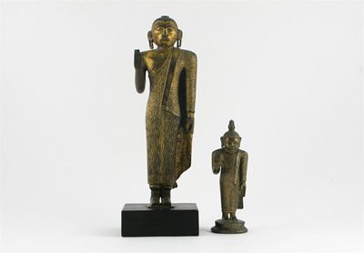 Appraisal: Two Sri Lankan bronze figures of Buddha the larger gilded