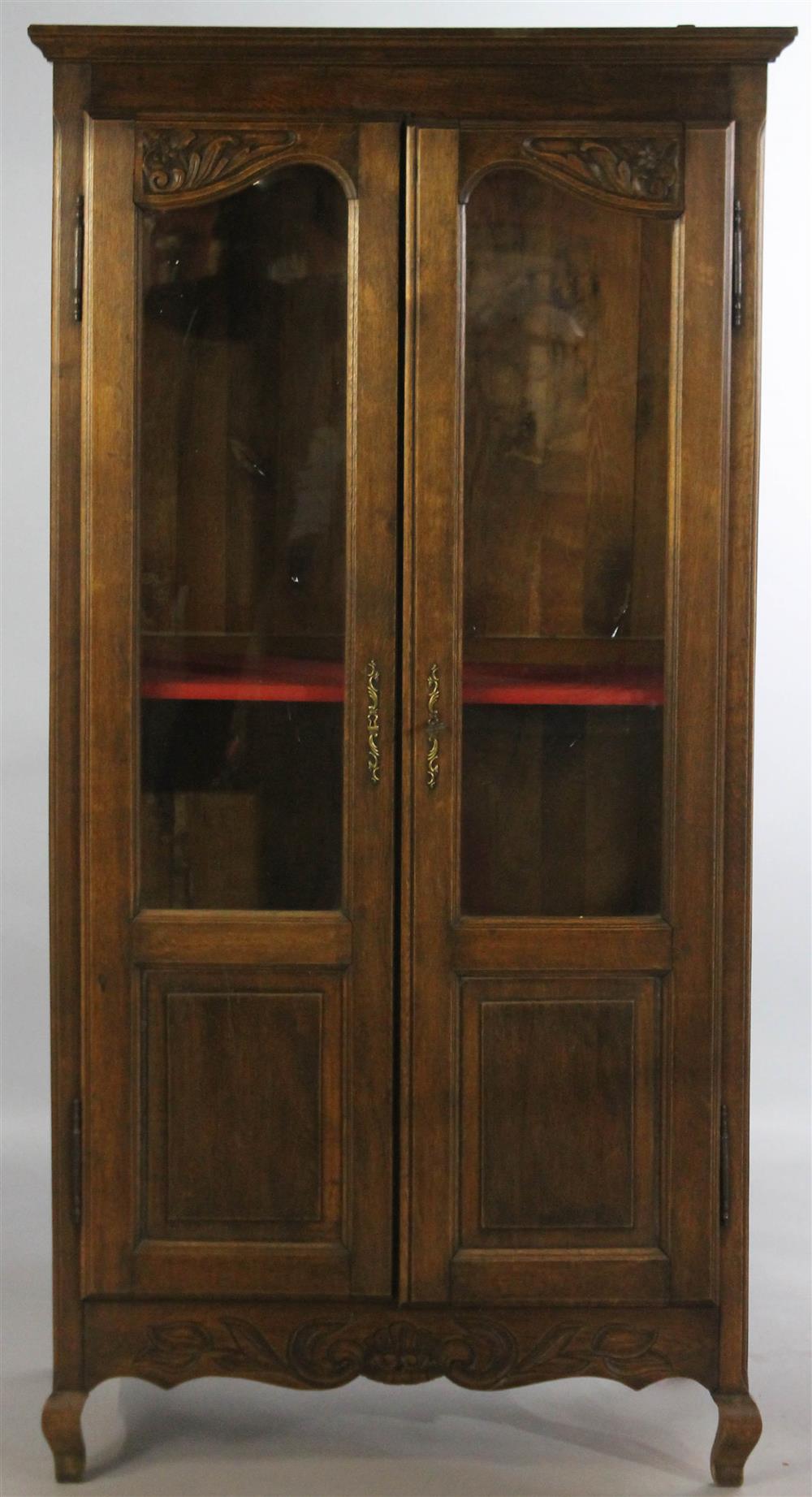 Appraisal: FRENCH PROVINCIAL STYLE OAK DISPLAY CABINET having a wide cornice