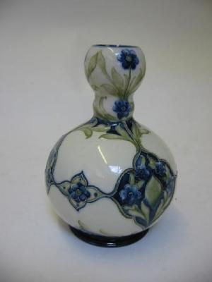 Appraisal: A MOORCROFT FLORIAN WARE VASE of bottle form with bulbous