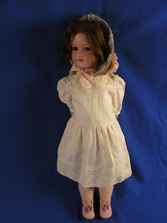 Appraisal: An Armand Marseille bisque headed doll with brown wig sleeping