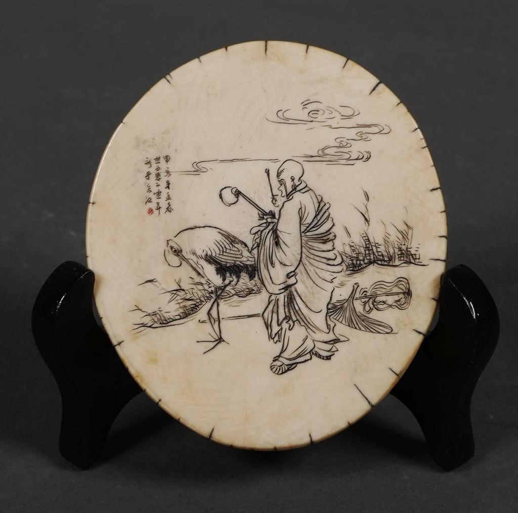 Appraisal: Antique Chinese incised ivory disk with scenes and writing on