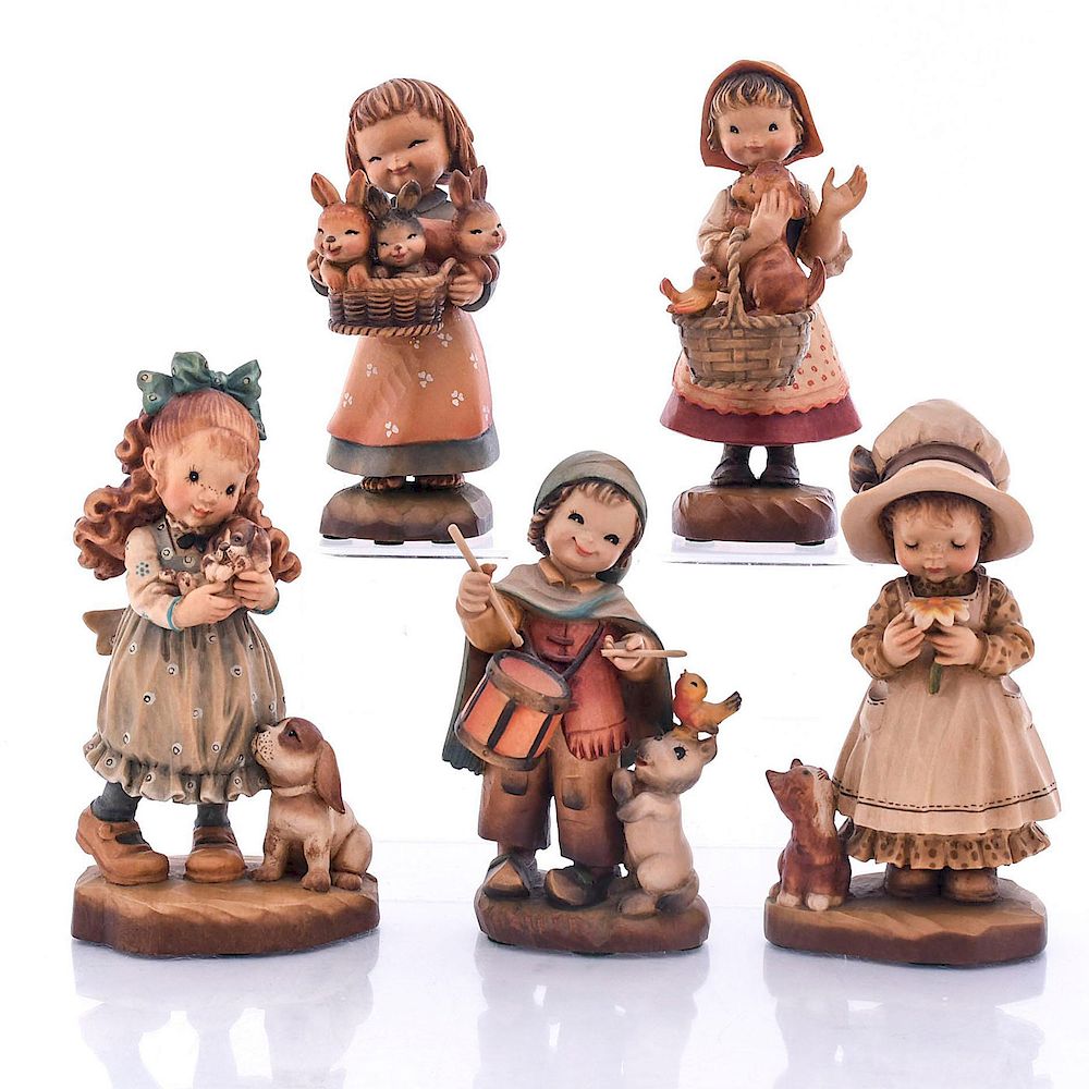 Appraisal: ANRI CARVED WOOD FIGURINES Children with animals With original boxes