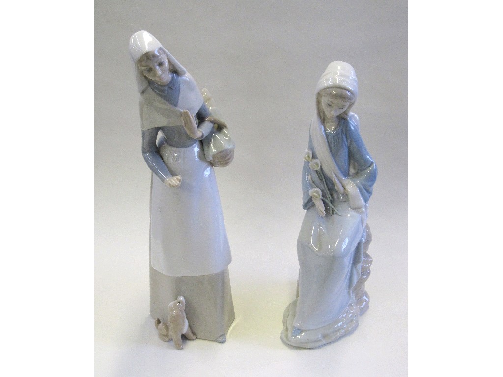 Appraisal: Two Lladro figures of women one slight def