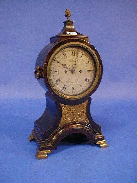 Appraisal: A George III ebonised balloon bracket clock with silvered dial