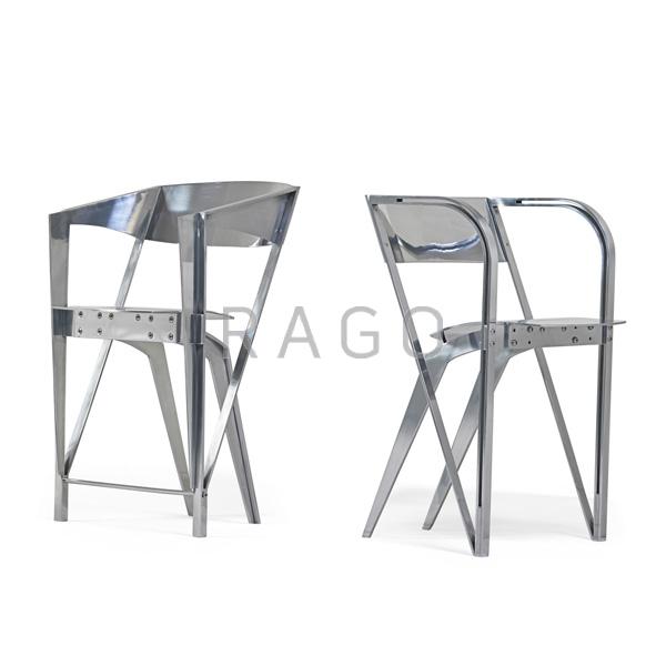 Appraisal: ROBERT WHITTON Two polished aluminum chairs Condition Report Taller has