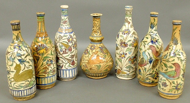 Appraisal: - Seven colorful Persian earthenware bottles th th c some