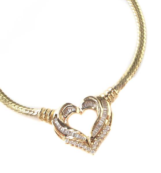 Appraisal: A diamond and gold heart pendant and necklace serpentine link