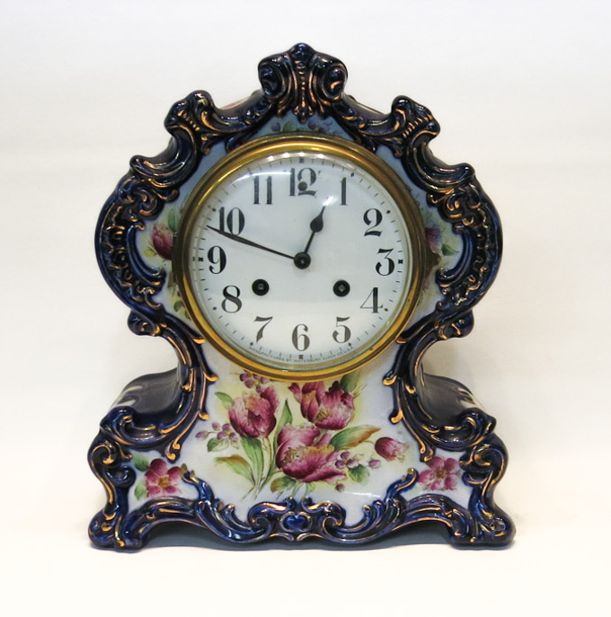 Appraisal: WATERBURY CHINA CASE MANTEL CLOCK having blue glaze with floral