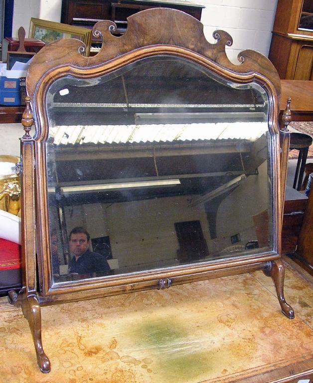 Appraisal: A reproduction walnut dressing mirror -