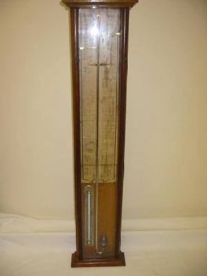 Appraisal: AN ADMIRAL FITZROY BAROMETER with paper register in plain oak