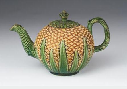 Appraisal: STAFFORDSHIRE CREAMWARE PINEAPPLE TEAPOT AND COVER CIRCA Of spherical form