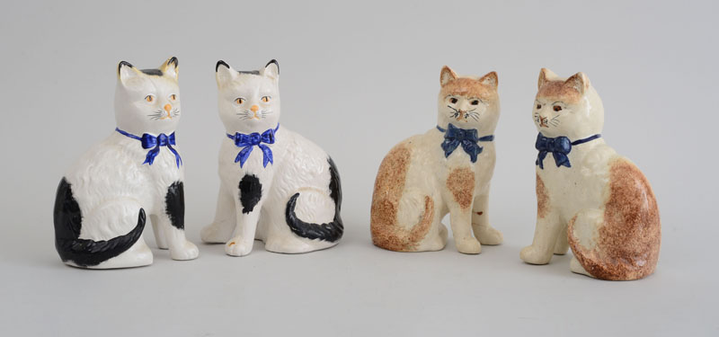 Appraisal: TWO PAIRS OF STAFFORDSHIRE POTTERY FIGURES OF SEATED CATS Each