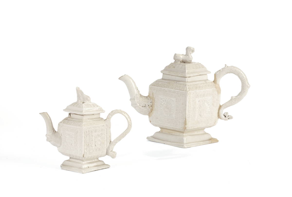 Appraisal: TWO STAFFORDSHIRE SALTGLAZE DIAMOND-SHAPED TEAPOTS AND COVERS CIRCA - Each