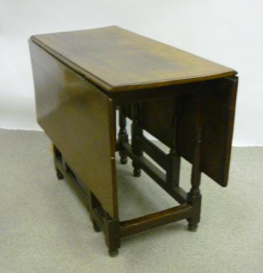 Appraisal: AN OAK DROP LEAF TABLE early th century and later